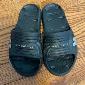 New Balance black youth flip flops size 2